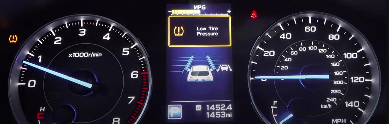 Low tire pressure message and warning light